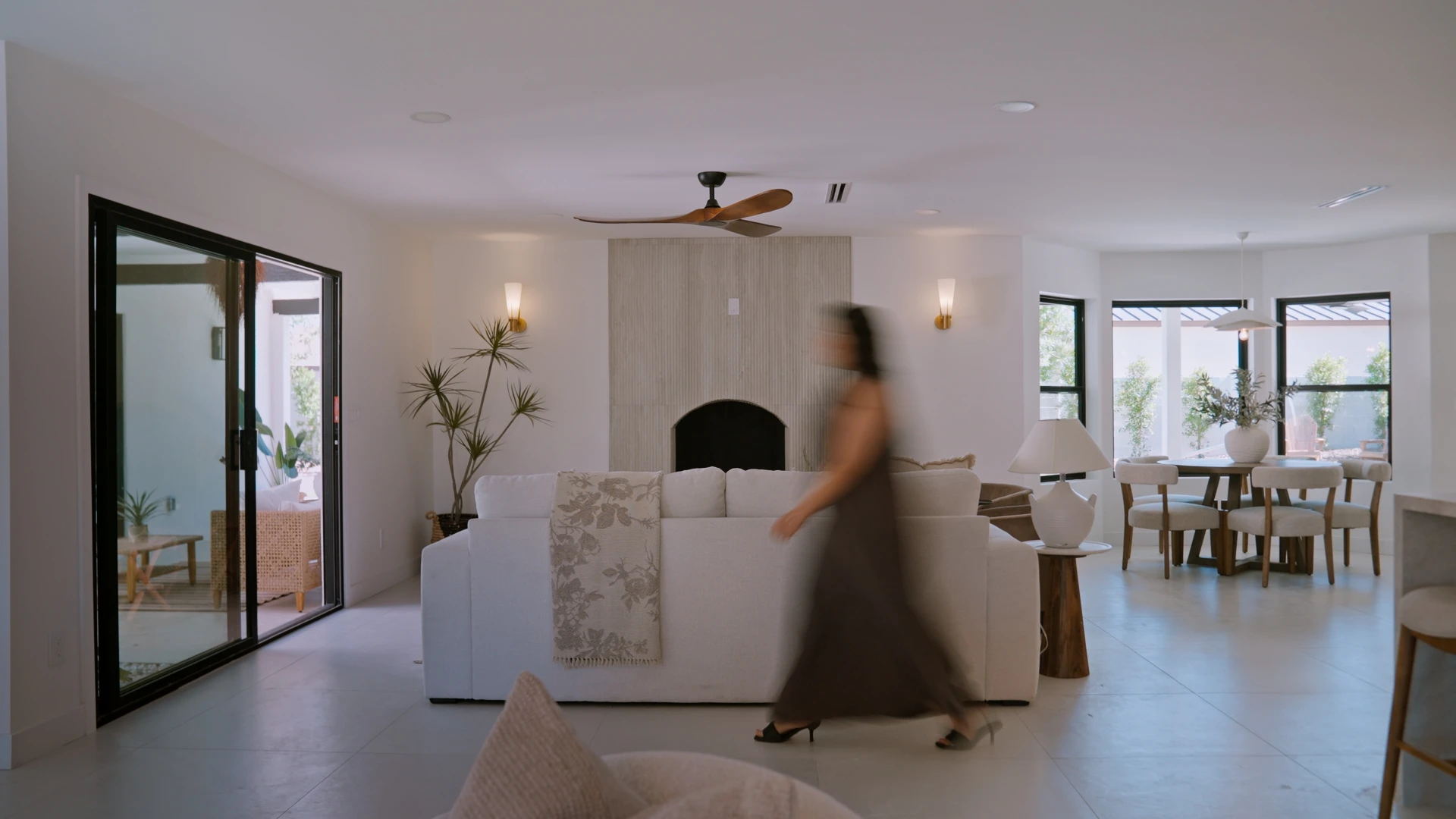 Living room with a fireplace and sliding glass doors