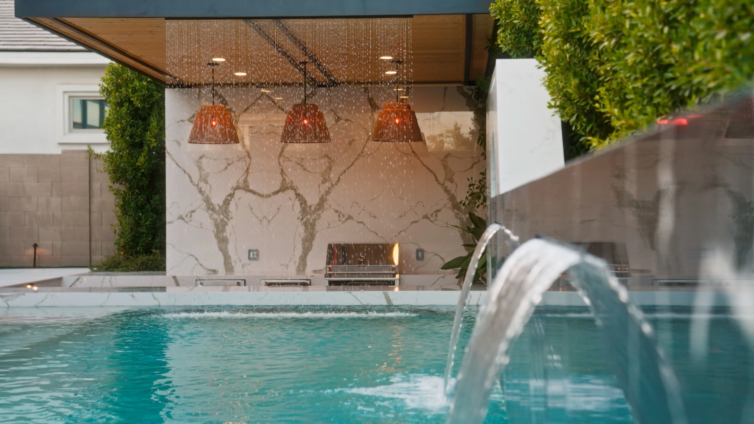 Water spout pouring into the pool